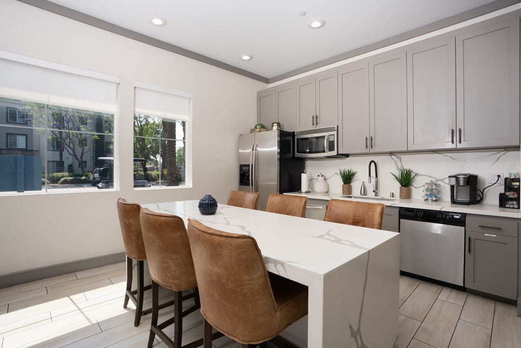 Kitchen with a white counter at The Grove Apartments, Ontario, CA