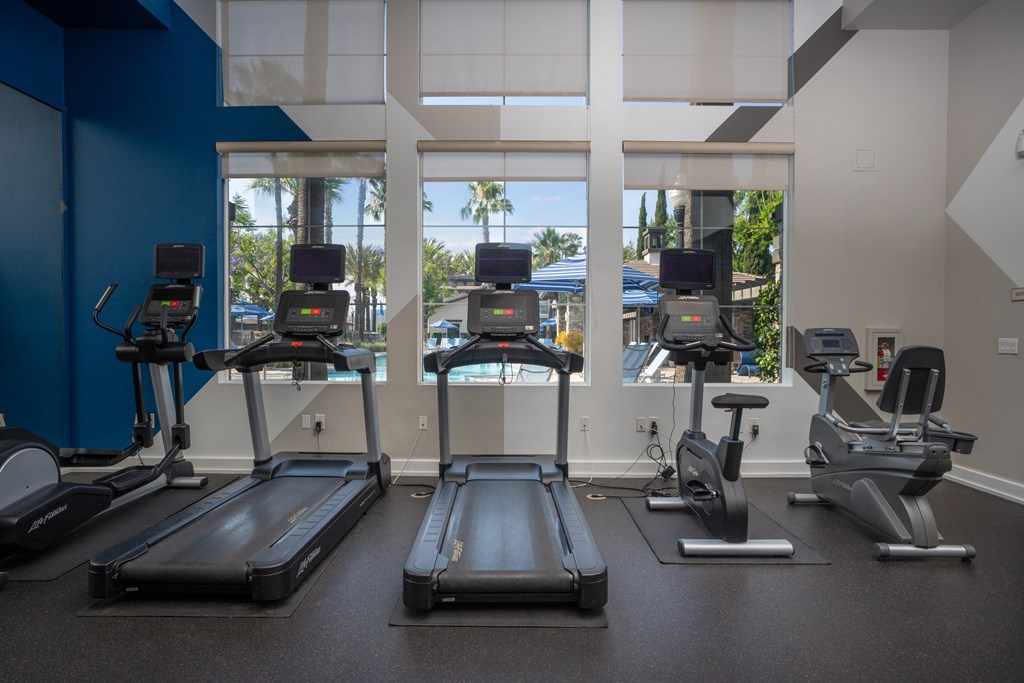 Gym with treadmills at The Grove Apartments, Ontario, California
