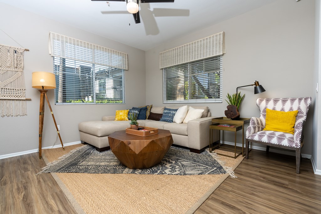 Living room with a wooden coffee table at The Grove Apartments, California, 91761