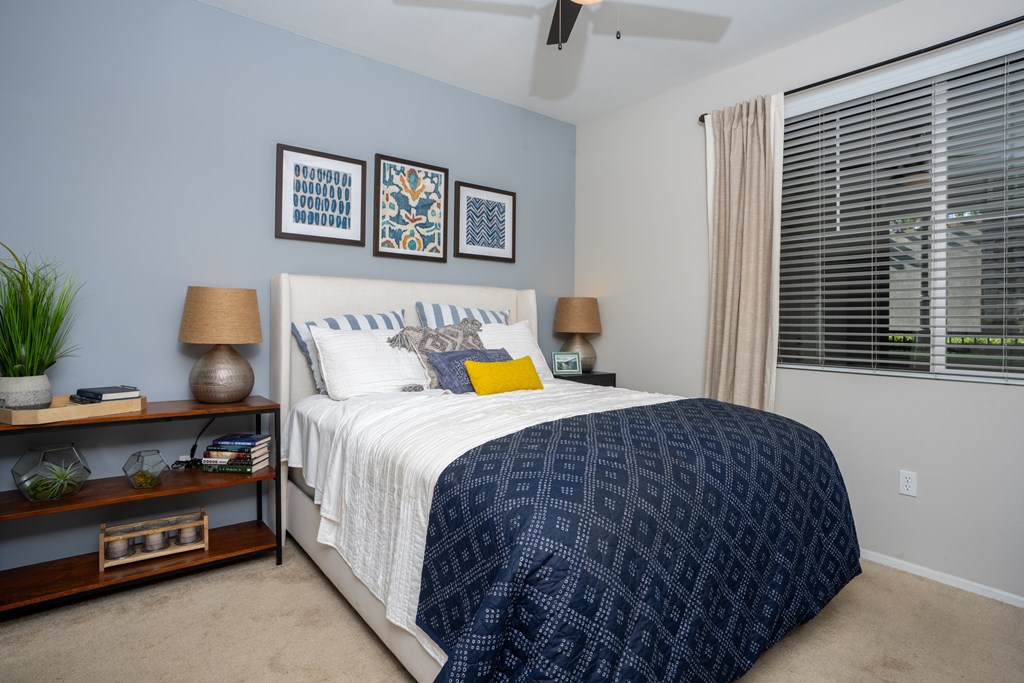 Bedroom with a bed at The Grove Apartments, Ontario, CA, 91761