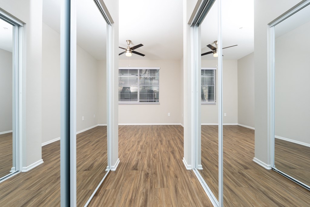 Room with wooden floor and ceiling fan at The Grove Apartments, California, 91761