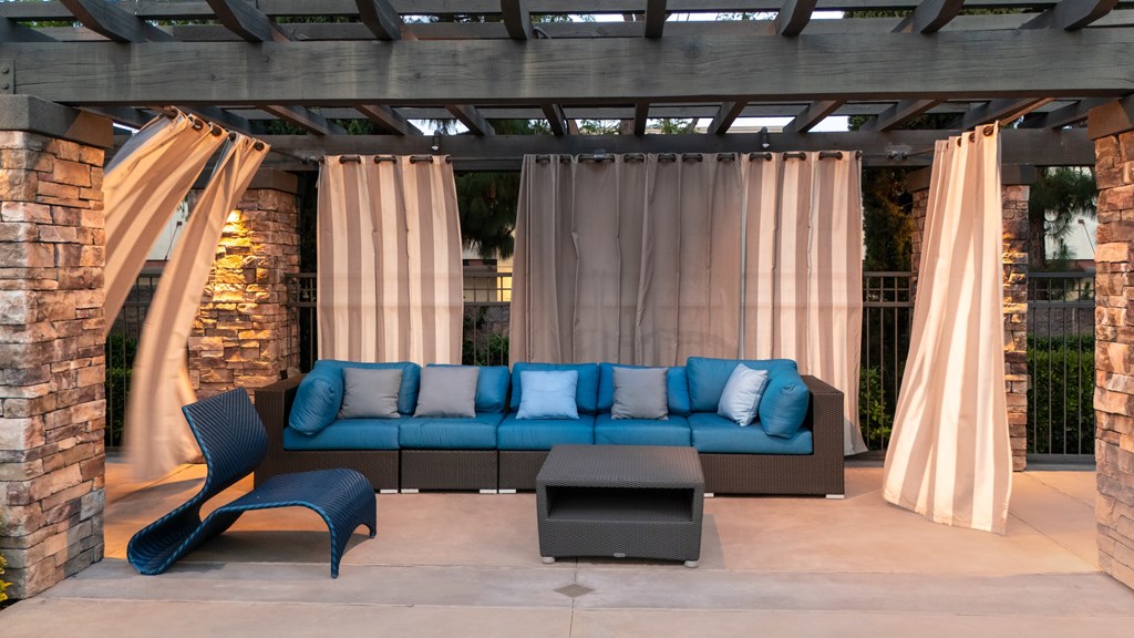 Blue couch with pillows at The Grove Apartments, California