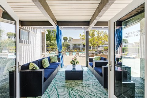 a living room with blue couches and a coffee table