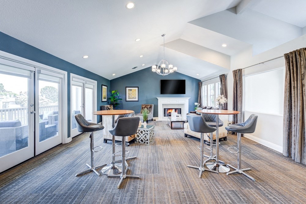 a living room with tables and chairs and a fireplace at Harbor Pointe, Dana Point, CA, 92629