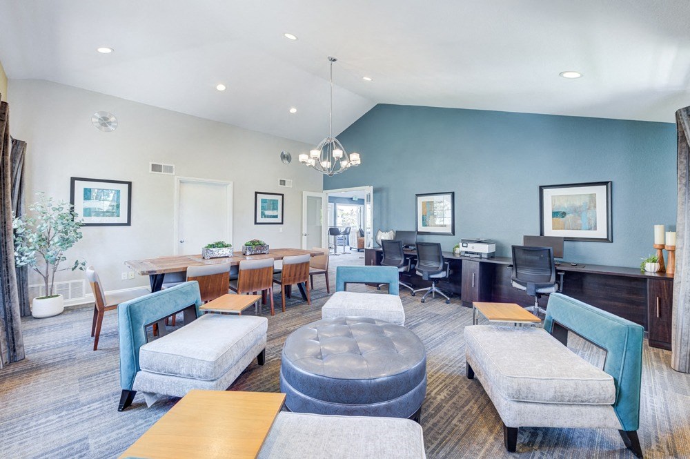 a large living room with tables and chairs and a desk with a computer at Harbor Pointe, California, 92629