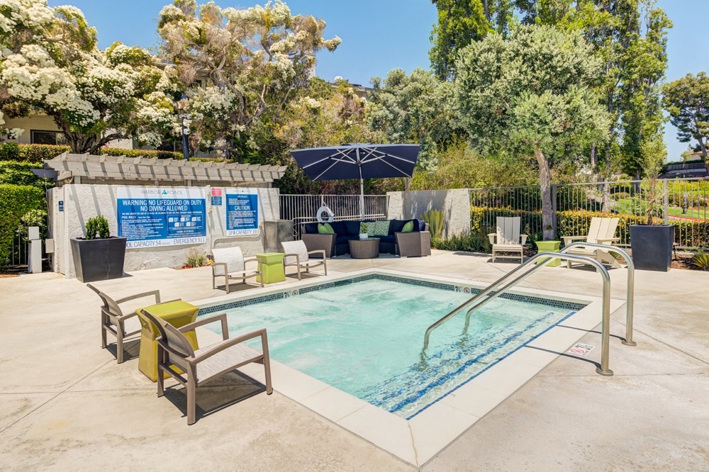 the pool at the preserve at ballantyne commons apartments with chairs and a pool at Harbor Pointe, Dana Point, 92629
