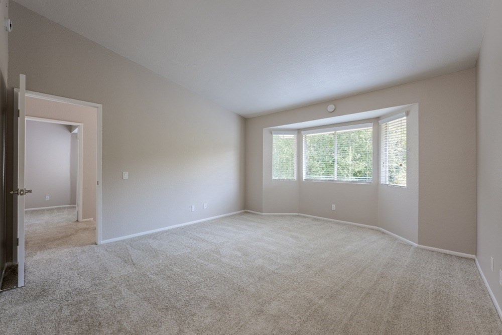 A large empty room with a door and a window. at Harbor Pointe, Dana Point, CA, 92629