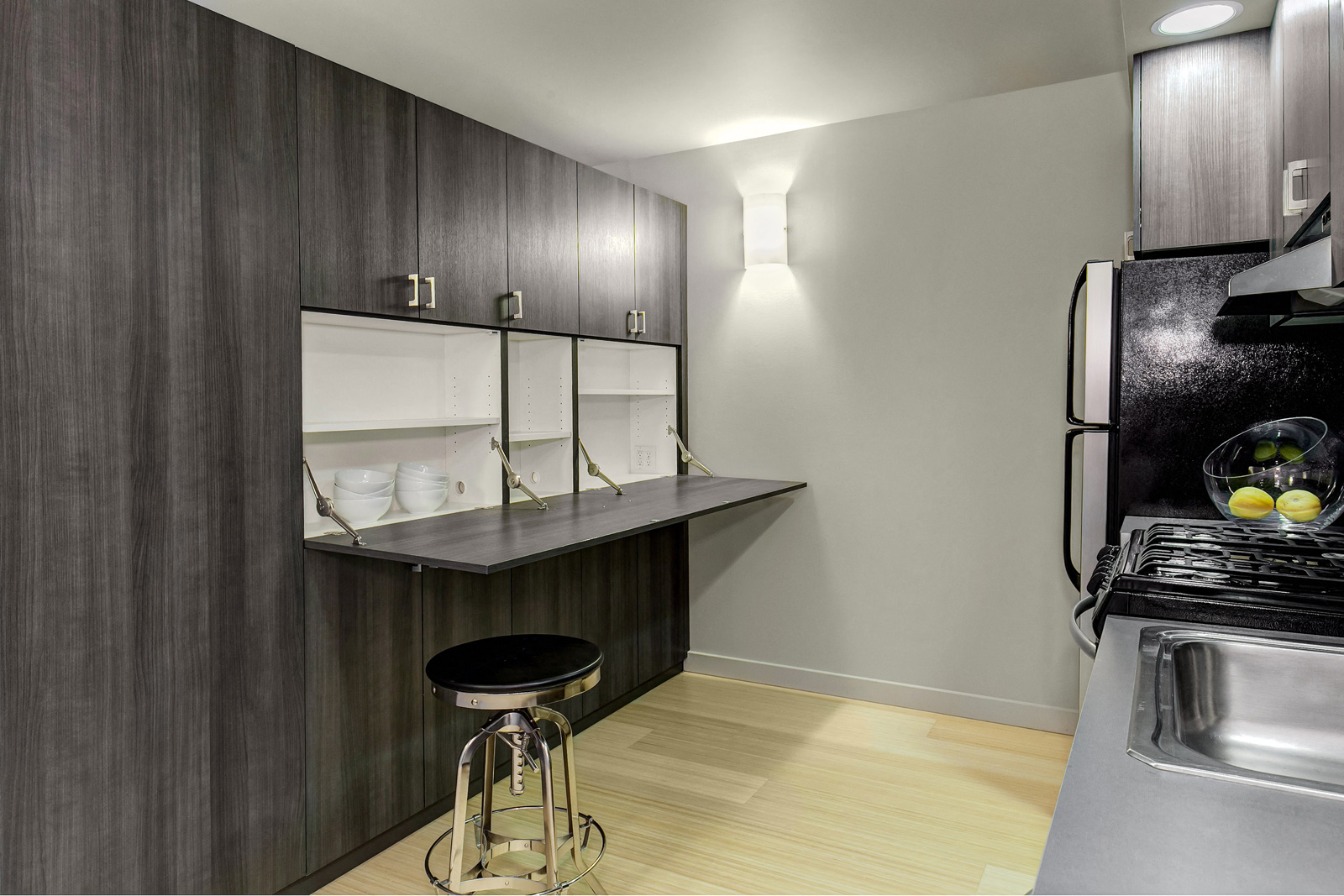 Kitchen with stainless steel appliances and storage space