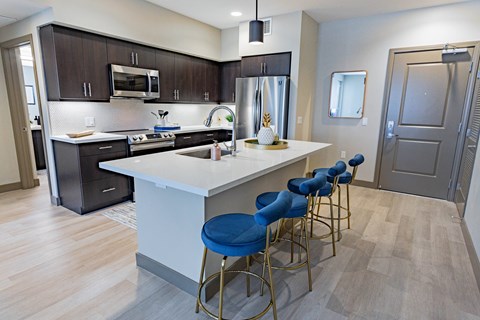 furnished kitchen with stool seating at Bayswater Apartments, Burlingame, CA