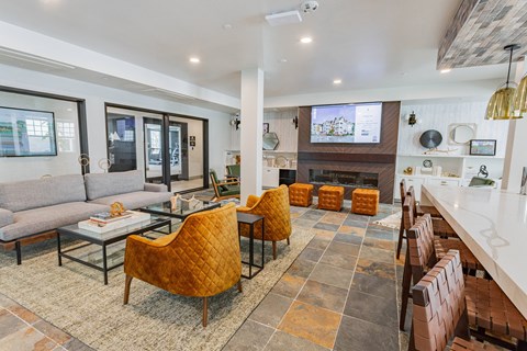 resident lounge with HD tv and lounge seating at Bayswater Apartments, Burlingame