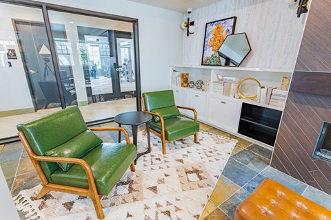 resident lounge with lounge chairs at Bayswater Apartments, Burlingame