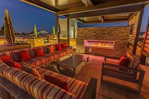 Expansive Rooftop Outdoor Fireplace And Grilling Area With Couches, Chairs, And Panoramic Views at Bayswater Apartments, Burlingame, 94010