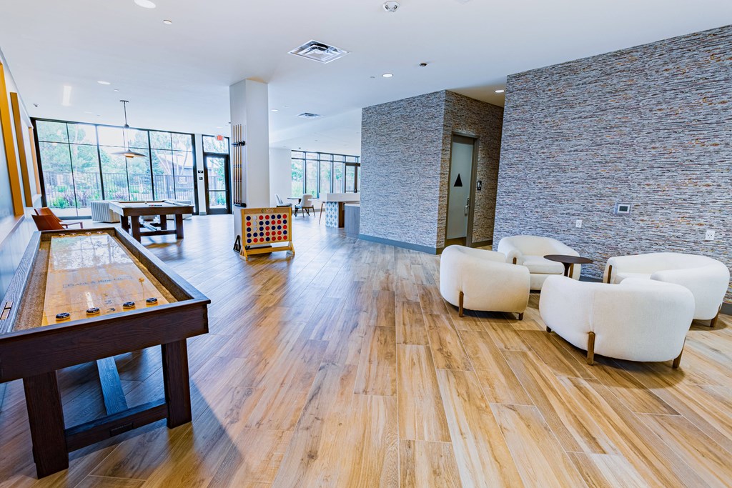 clubhouse with wooden flooring and chairs