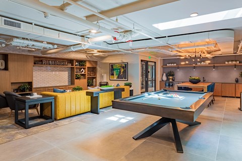 social clubhouse with pool table and stylish seating area