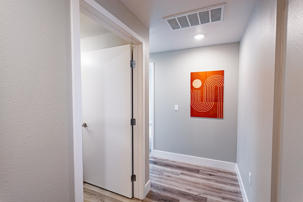 Hallway with grey walls and artwork on wall