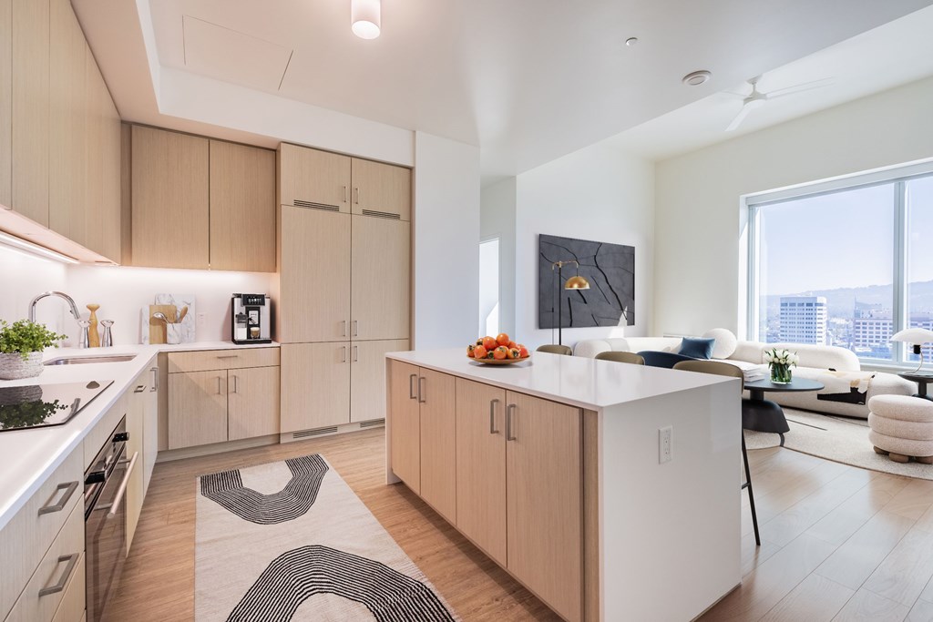 A modern kitchen with wooden cabinets and a white island.