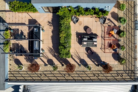 a birds eye view of a house with a courtyard and plants