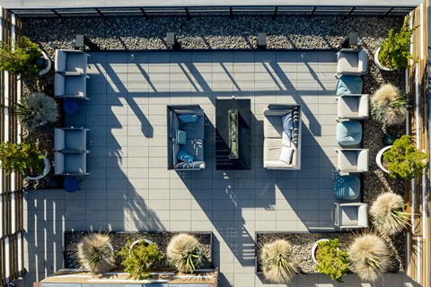 a birds eye view of a house with plants on the ground