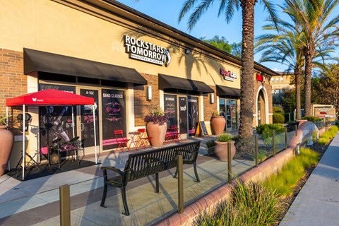 A storefront with a red awning and a sign that reads "Rockstar Tomorrow.".