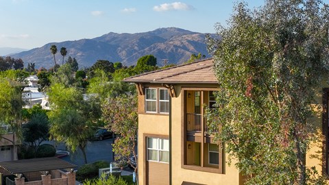 A building with a mountain in the background.