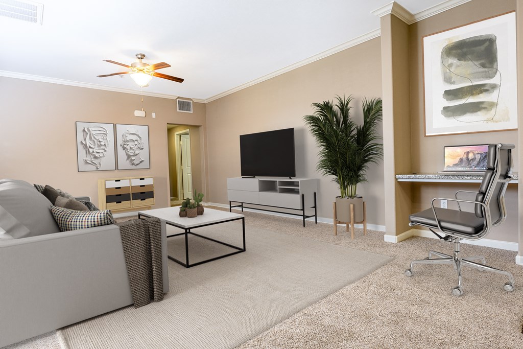 livingroom with couch, coffee table and TV and pictures on the wall.
