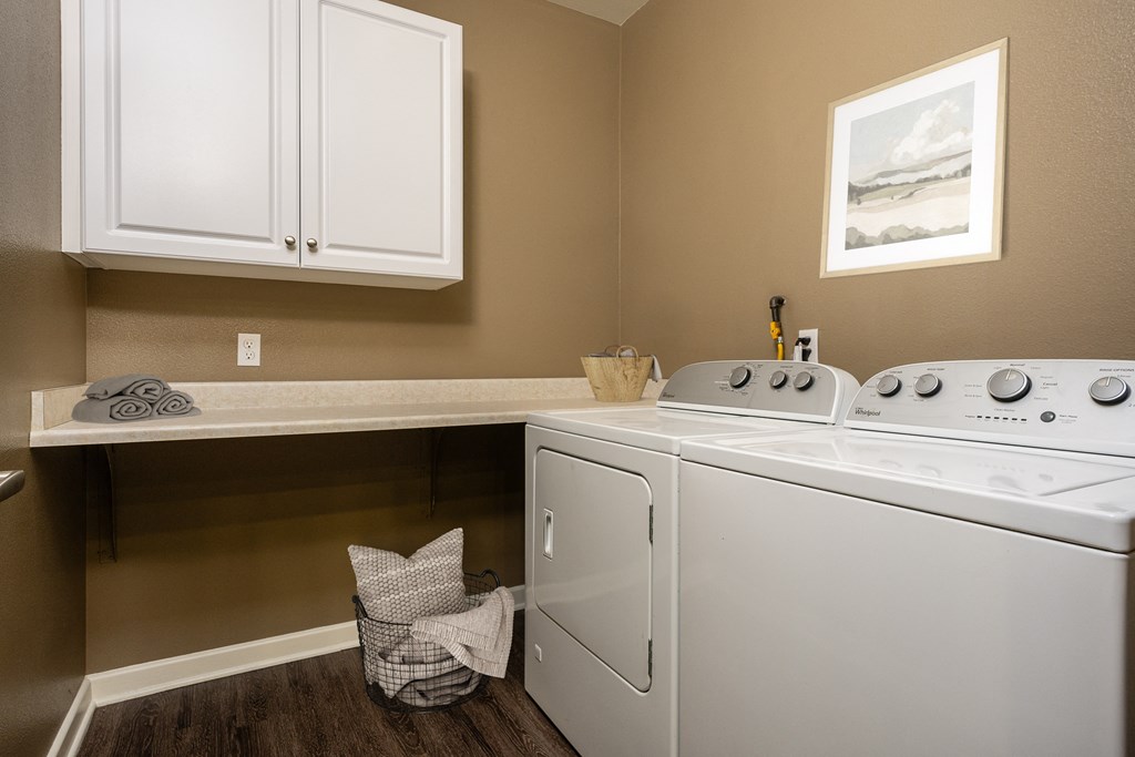 a laundry room with a washer and dryer