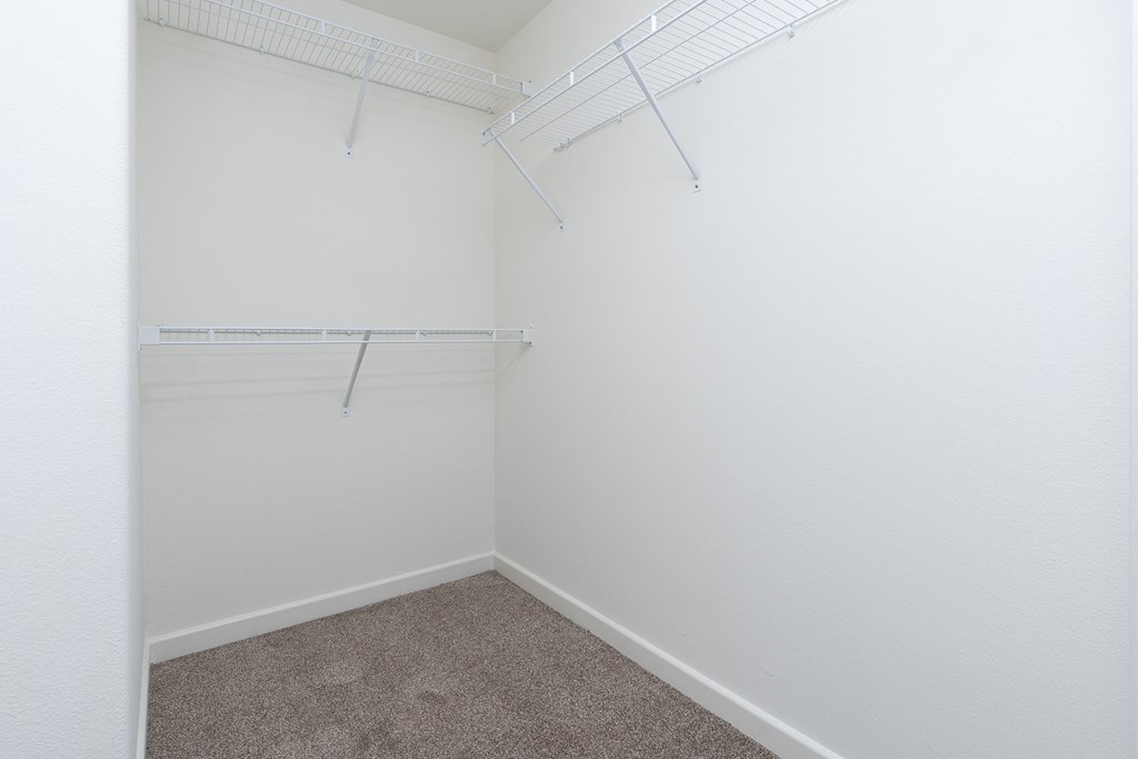 a walk in closet in a 555 waverly unit