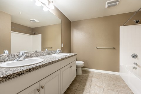 a bathroom with a toilet sink and bathtub
