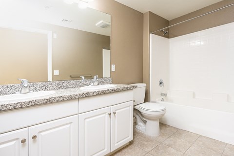 a bathroom with a toilet sink and bathtub