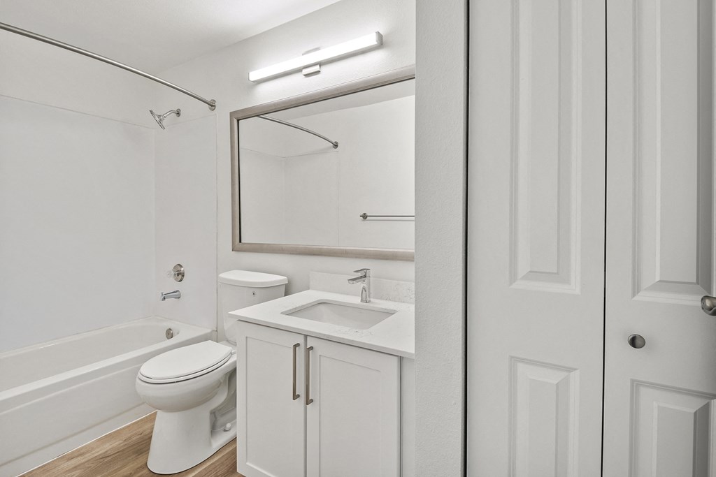 a bathroom with a toilet sink and bathtub