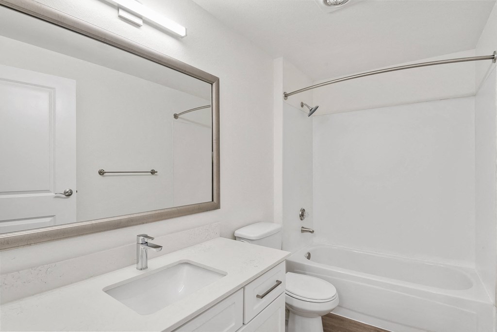 a bathroom with a sink toilet and bathtub