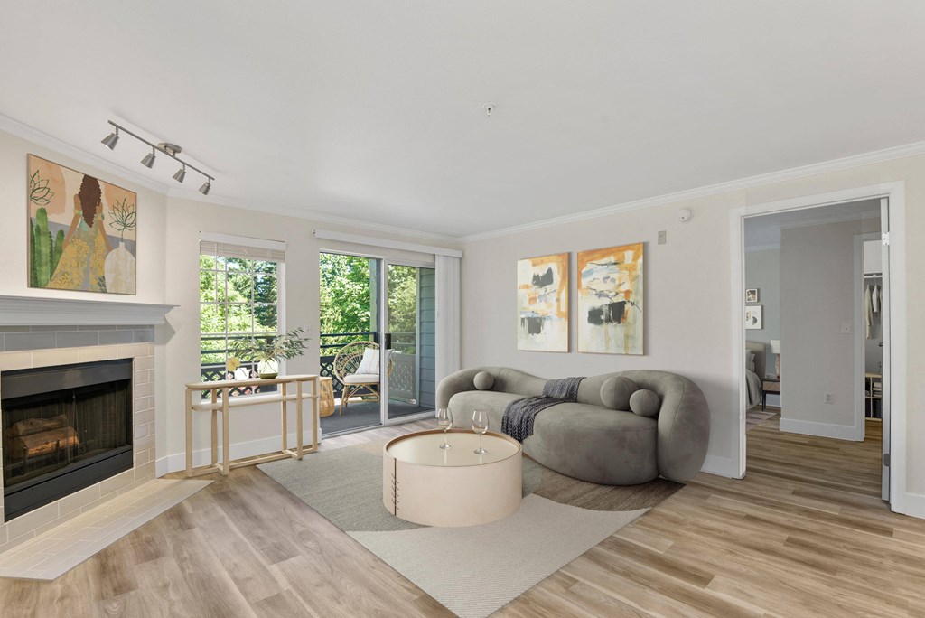 a living room with a large gray couch and a round coffee table