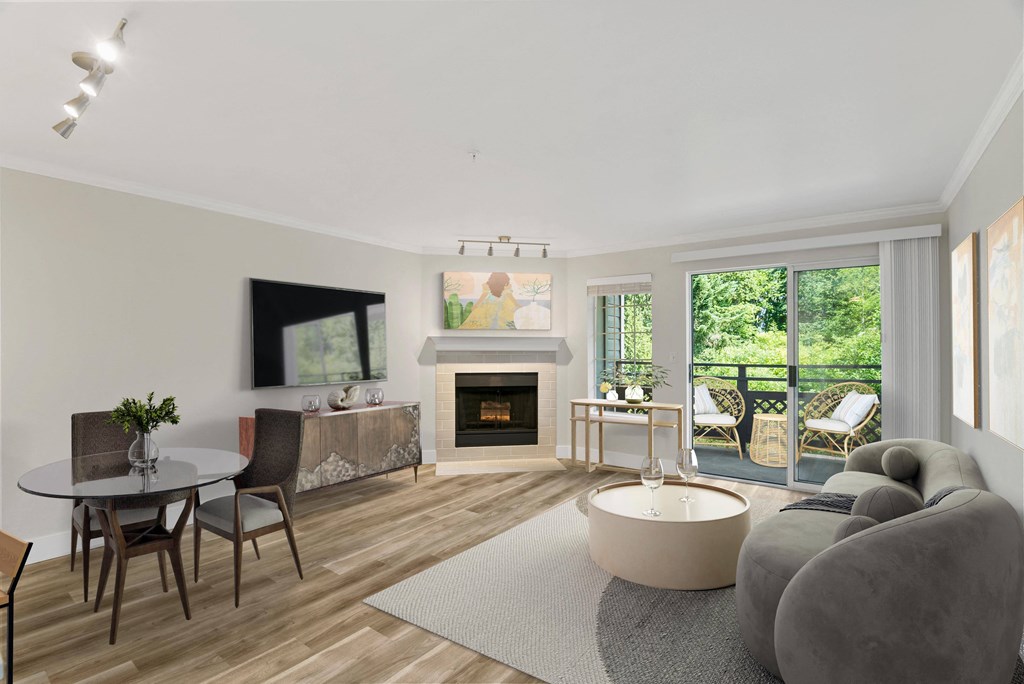a living room with a fireplace and sliding glass doors