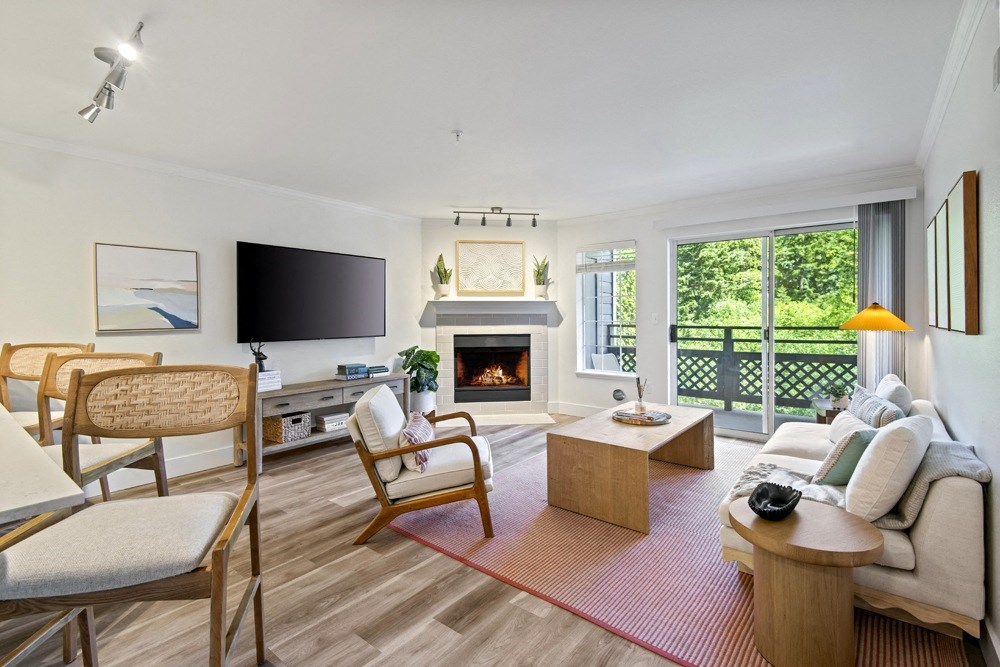 a living room with a fireplace and a television at Lakemont Orchard, Washington
