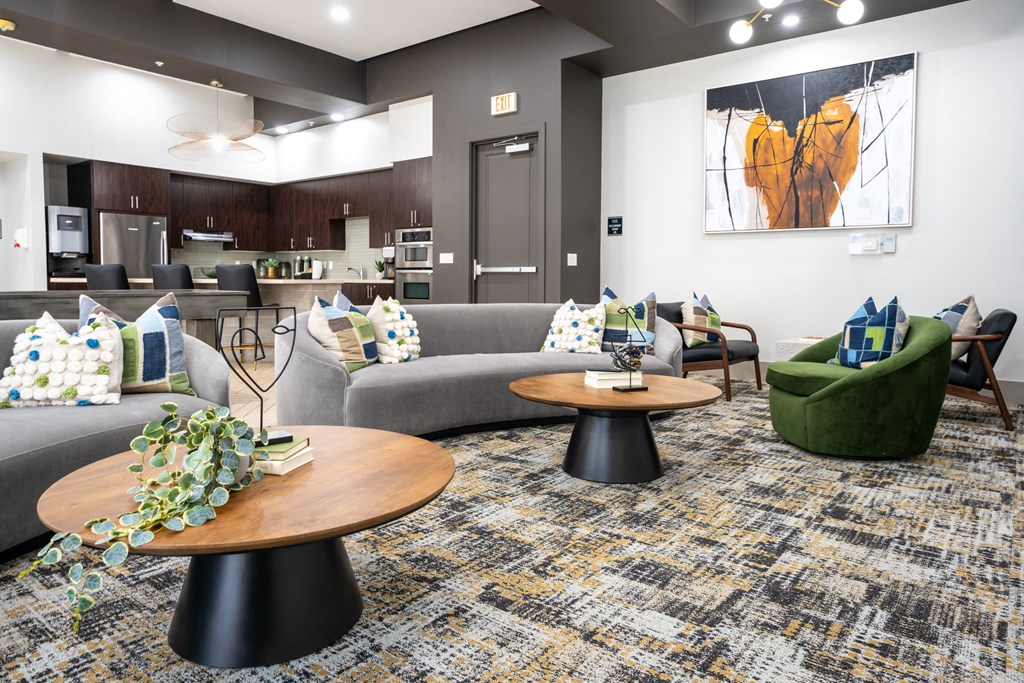 a living room with couches and tables