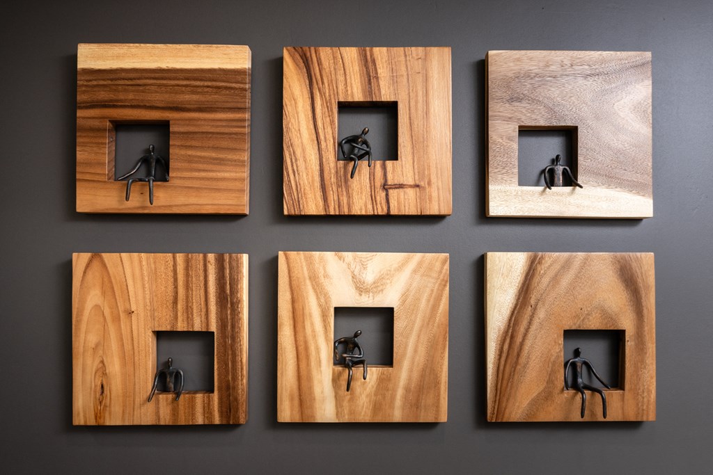 a man and a woman in a niche in a wood wall