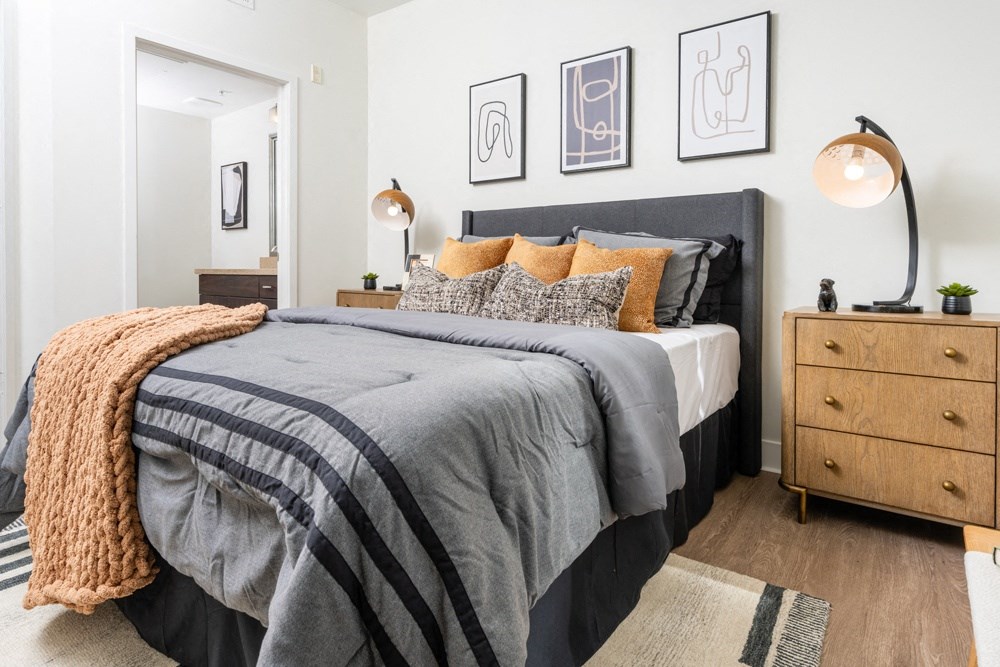 a bedroom with a bed and a dresser