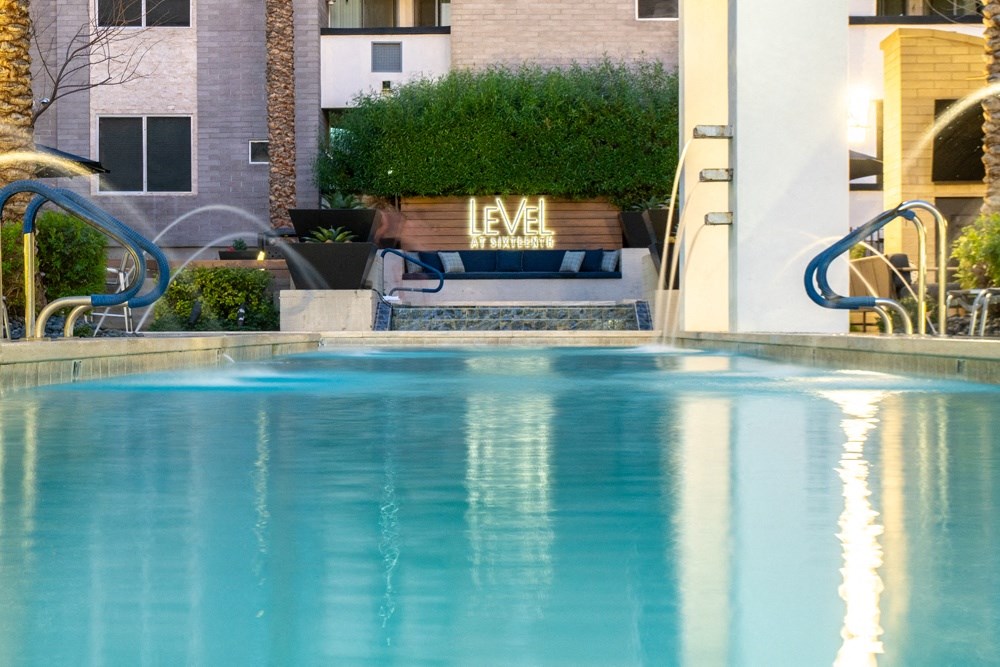 a swimming pool with a building in the background
