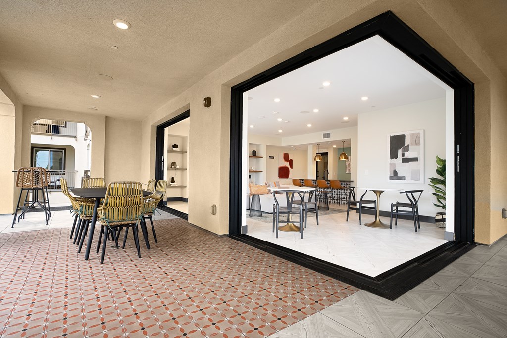 a large window in a room with a table and chairs