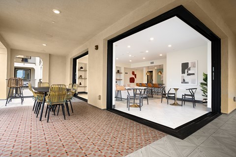 a large window in a room with a table and chairs