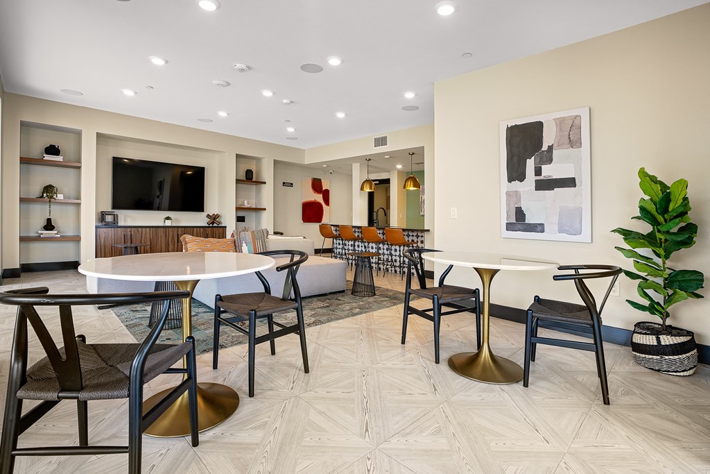 a resident clubhouse with tables and chairs