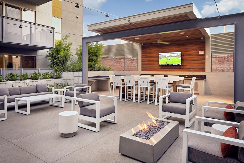 outdoor lounge with firepits and TV at Main+Nine, California
