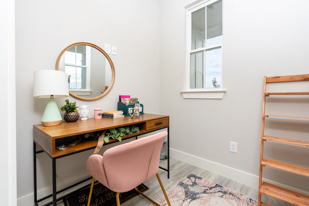 a room and a chair and a mirror at Mihir Taylor, Taylor, 76574