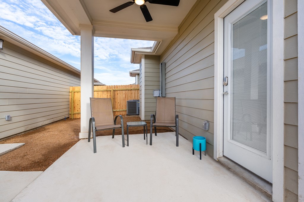 model  front porch of a house with a patio and two chairs at Mihir Taylor, Taylor, TX