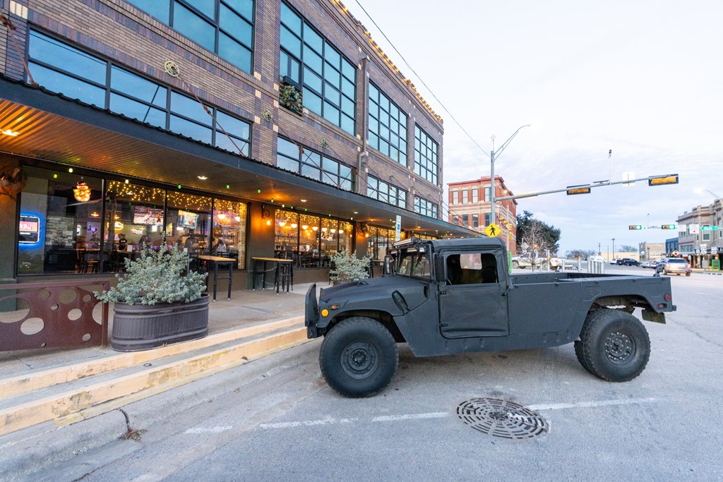 a truck parked in front of a restaurant on the street at Mihir Taylor, Taylor