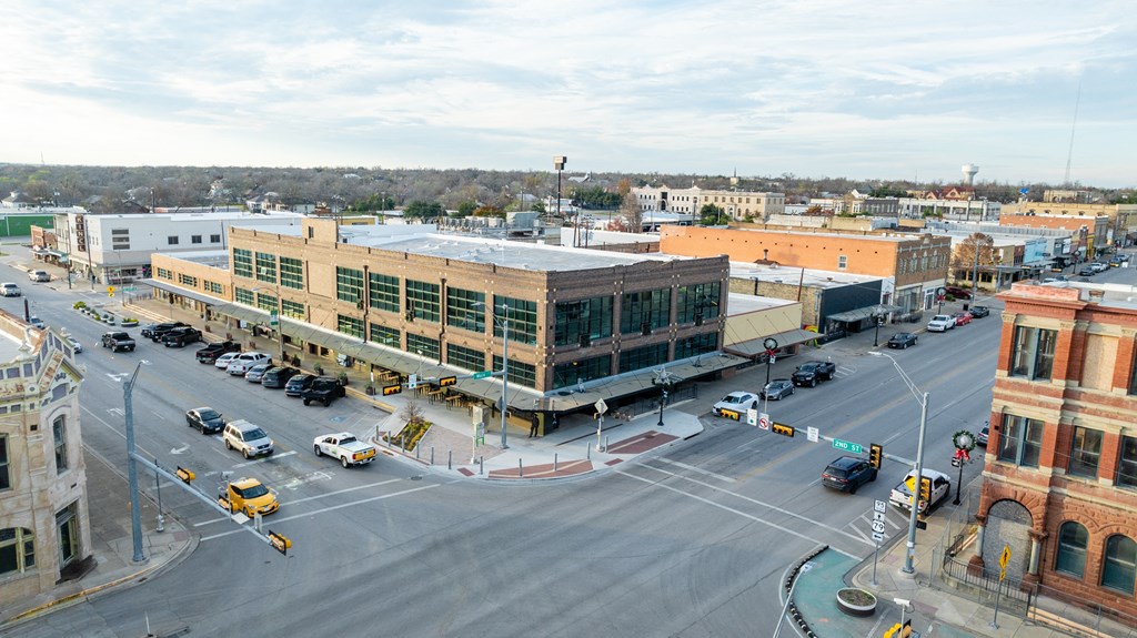 an aerial view of a city street with buildings and cars at Mihir Taylor, Texas