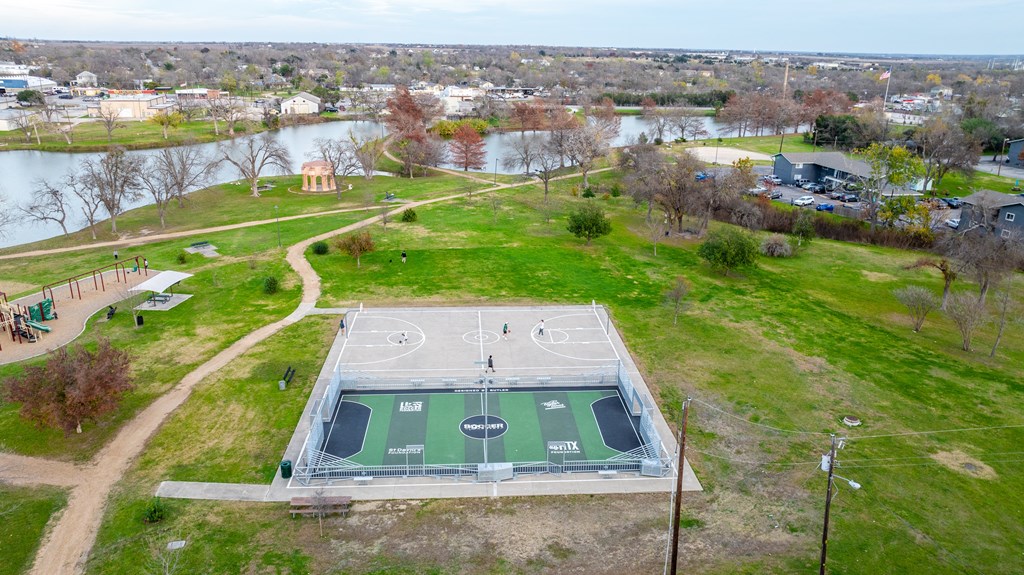 an aerial view of a basketball court on top of a green field at Mihir Taylor, Taylor, TX 76574