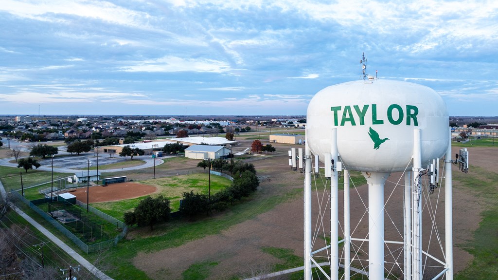 the water tower with the city in the background at Mihir Taylor, Taylor
