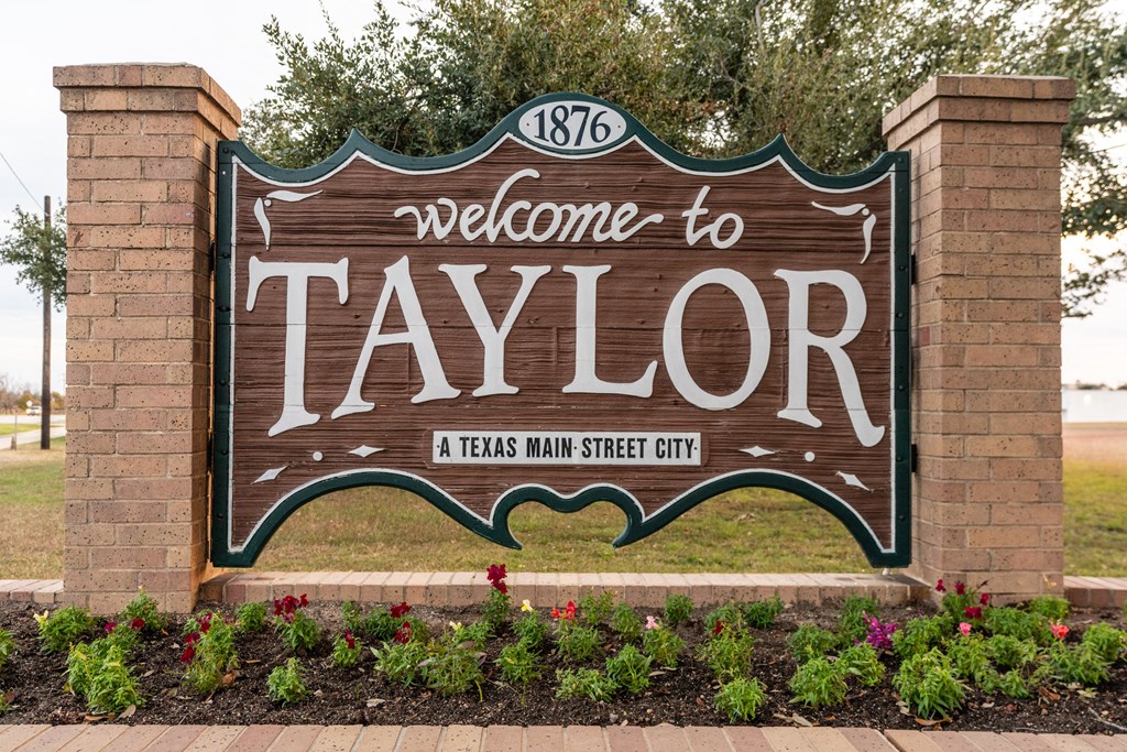 the welcome sign at the entrance to the city of taylor texas at Mihir Taylor, Taylor