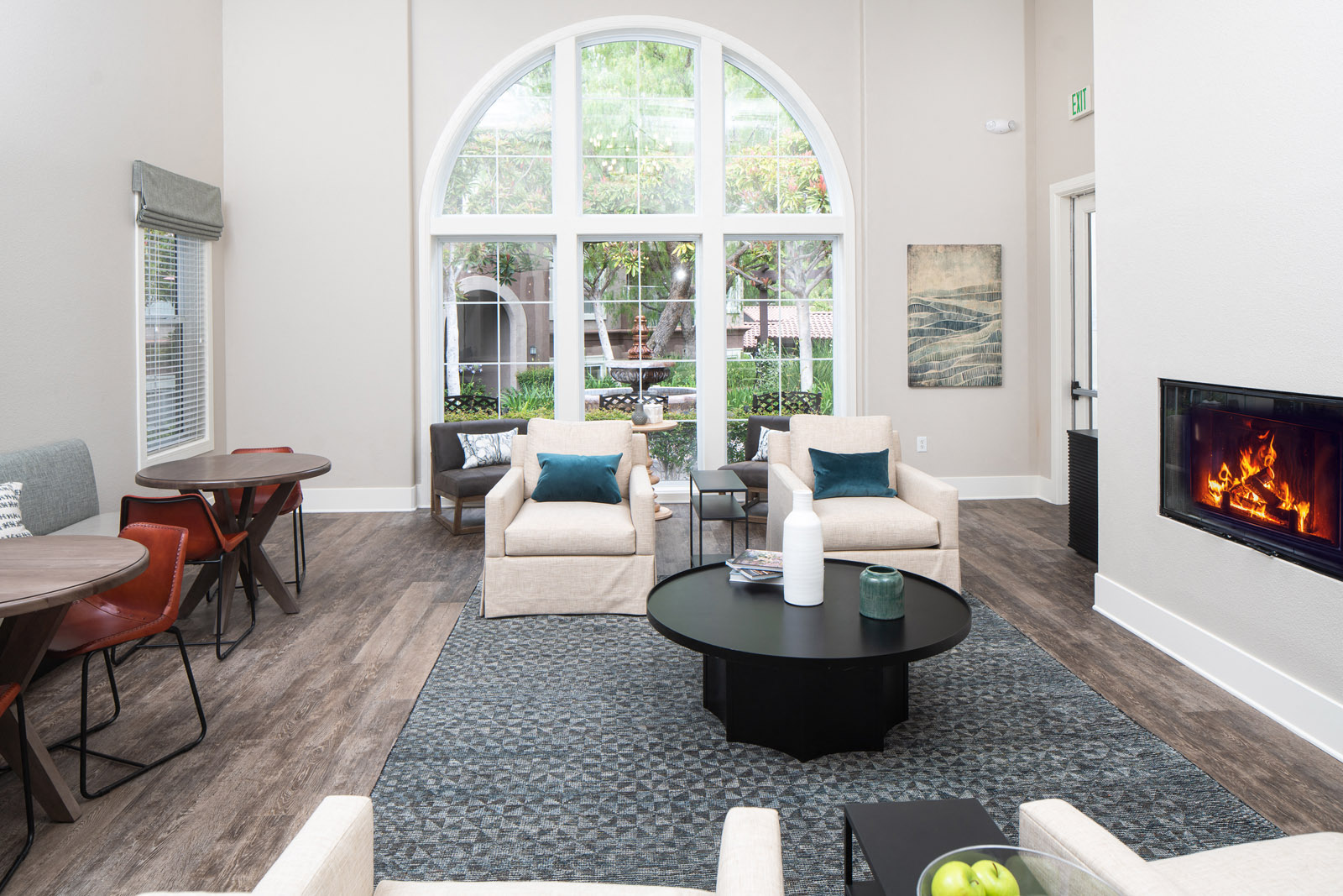 Resident lounge with seating and fireplace